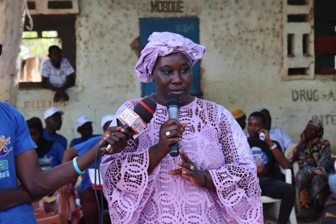 Woman leader speaking at a public declaration to abandon female genital cutting and child marriage in Gambia.